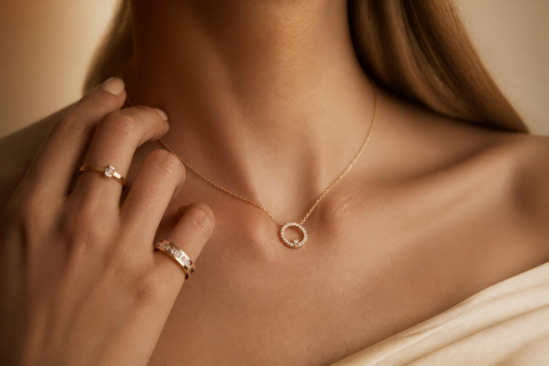 A woman wearing a delicate gold diamond pendant